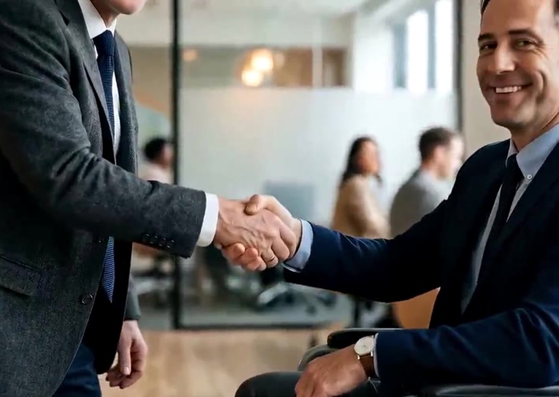 Funding specialist shaking hands with a business owner
